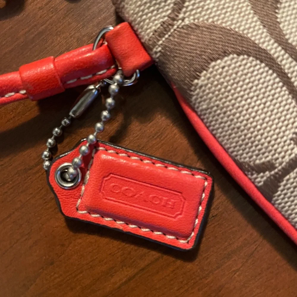 COACH Signature Fabric with Orange Leather Wristlet